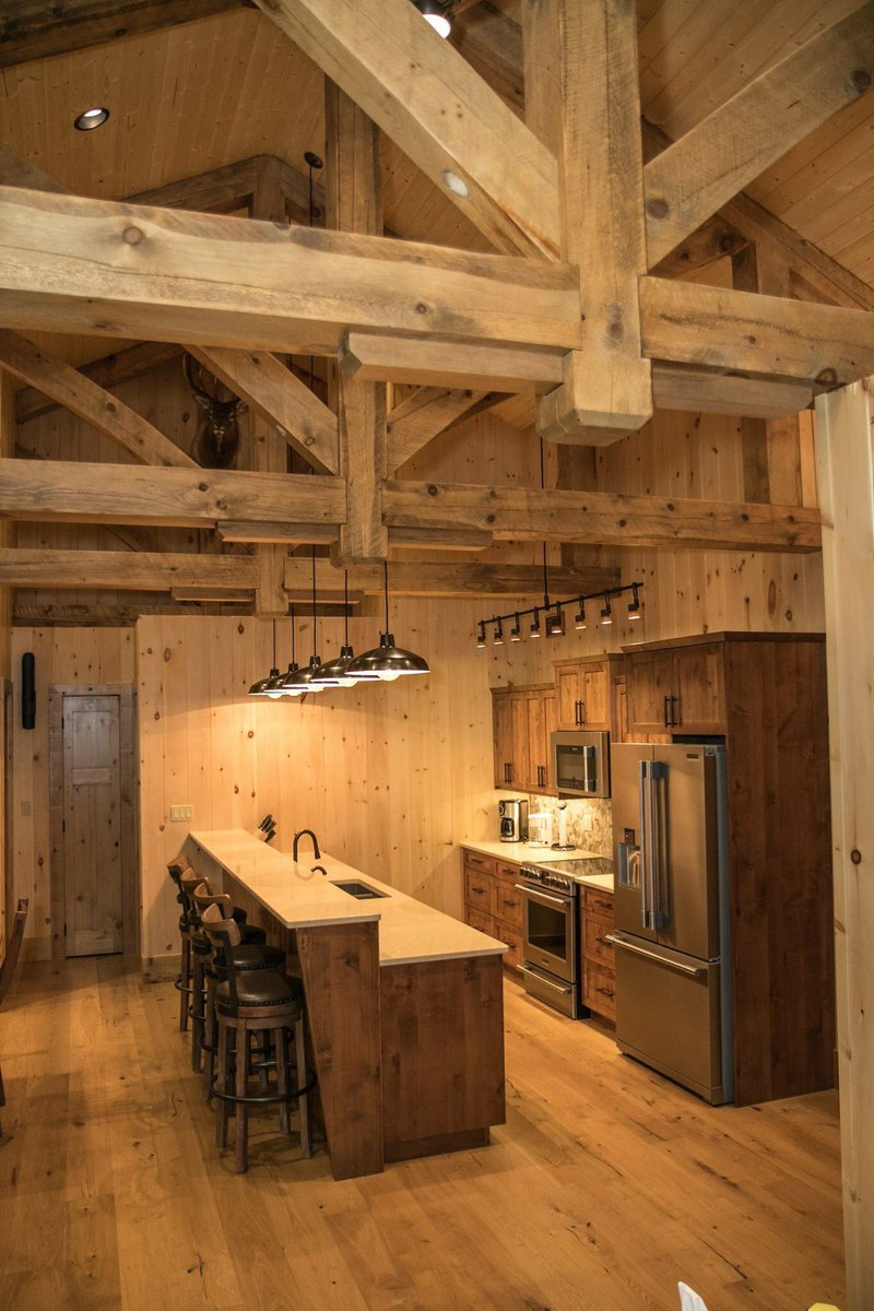 Collyerconstruc's tweet photo. This kitchen is a stunner!  With incredible beam work, and a priceless view of the lake, you can bet this is the centrepiece of this lakefront home. https://t.co/DVoaaYuN0G