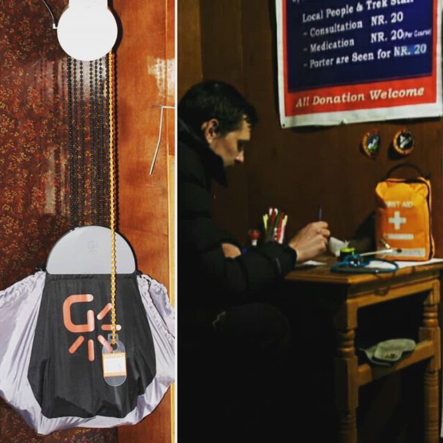 IPPGUK's tweet photo. IPPG volunteer Dr. Todner writes medical notes under our new #gravitylight at the #IPPG Gokyo rescue post in Nepal. Allows us to save our batteries for the oxygen concentrators. Many many thanks @thegravitylightfoundation https://t.co/cVF8Z2OW4o https://t.co/EA1aEtoPZl