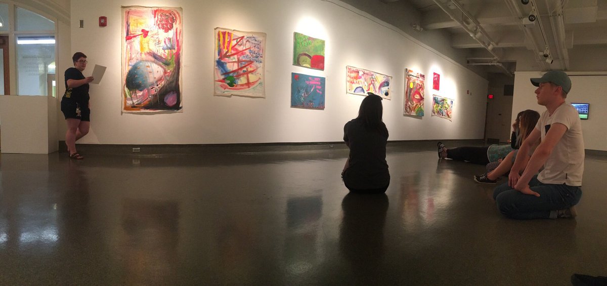 KStateArtDept's tweet photo. Alex Dau, senior pursuing her BFA in painting, shares her artist statement and work to the Advanced Painting class during her BFA show in Willard last week. #KState #artdept #art #paint #painting #BFA #BFAshow #artiststatement #ART650 #senior #graduating https://t.co/z7241JIXhU