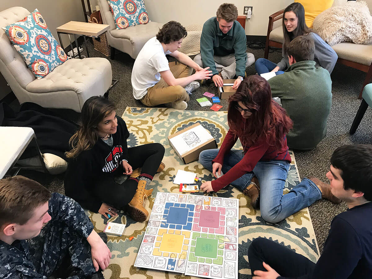 ndmagazine's tweet photo. RT @ArtsLettersND A @NotreDameArt graduate student designed and hand-crafted a board game that is getting @NotreDame first-year students to talk about tough topics, like unhealthy drinking habits. https://t.co/LDWamCcioN https://t.co/s0XVKai5Jc