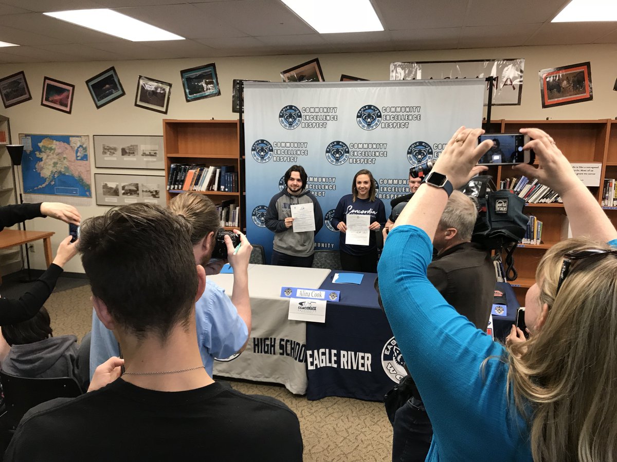 MrMartyLang's tweet photo. A crowd gather today at lunch to witness Eagle River High School scholar athletes Christian Frederick (baseball), Alina Cook (softball), & Grant Burningham (wrestling) sign their collegiate letters of intent! #ERHSpride #Excellence https://t.co/f9lScFiIGb