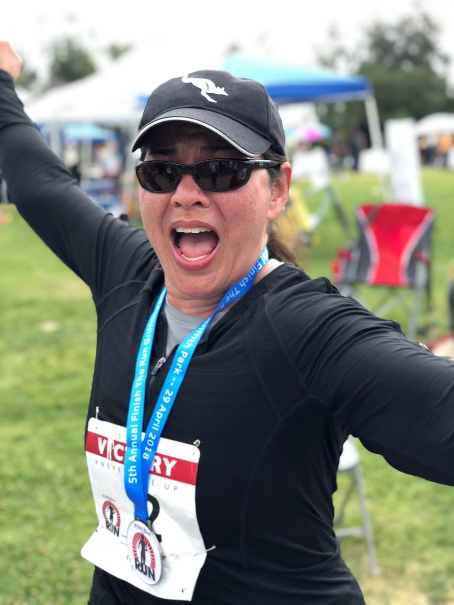 HeatherJRuiz's tweet photo. Cynthia Balkom, the administrative assistant to the CEO, shows how she was feeling at the finish line. "This is a community effort where everyone takes care of each other. That's what mission means to me."   #LivingOurAHMission https://t.co/YNkvXoZ7zY