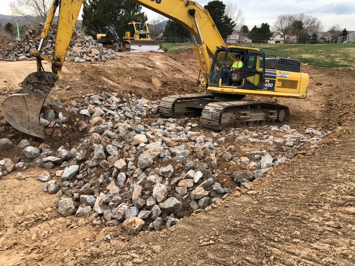 Mixing void filled riprap at Beers Sisters Reservoir. #SoilStabilization #FloodControlDistrict