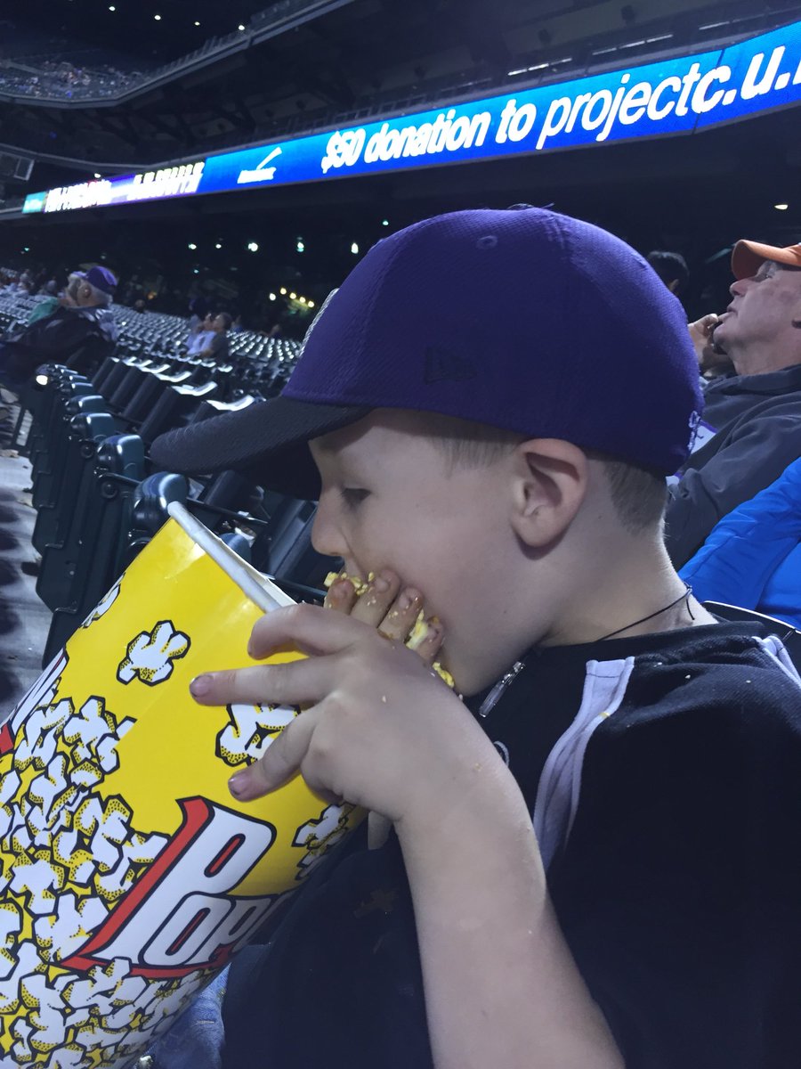 frazierashlynn's tweet photo. @Rockies @courtneystubb @Jbarg0221 He may have been more interested in the popcorn than his first game https://t.co/AK0sSVagrw