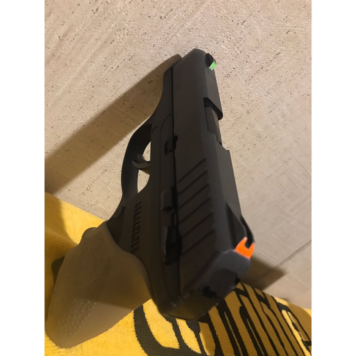 tweetmemichael's tweet image. A little #modmonday / #tinkering Tuesday 
Painted my factory, fixed sights, and I'm pretty happy with the results! 
#gunmods #paintedsights #hoguegrips #rugerec9s #ruger #beforeandafter