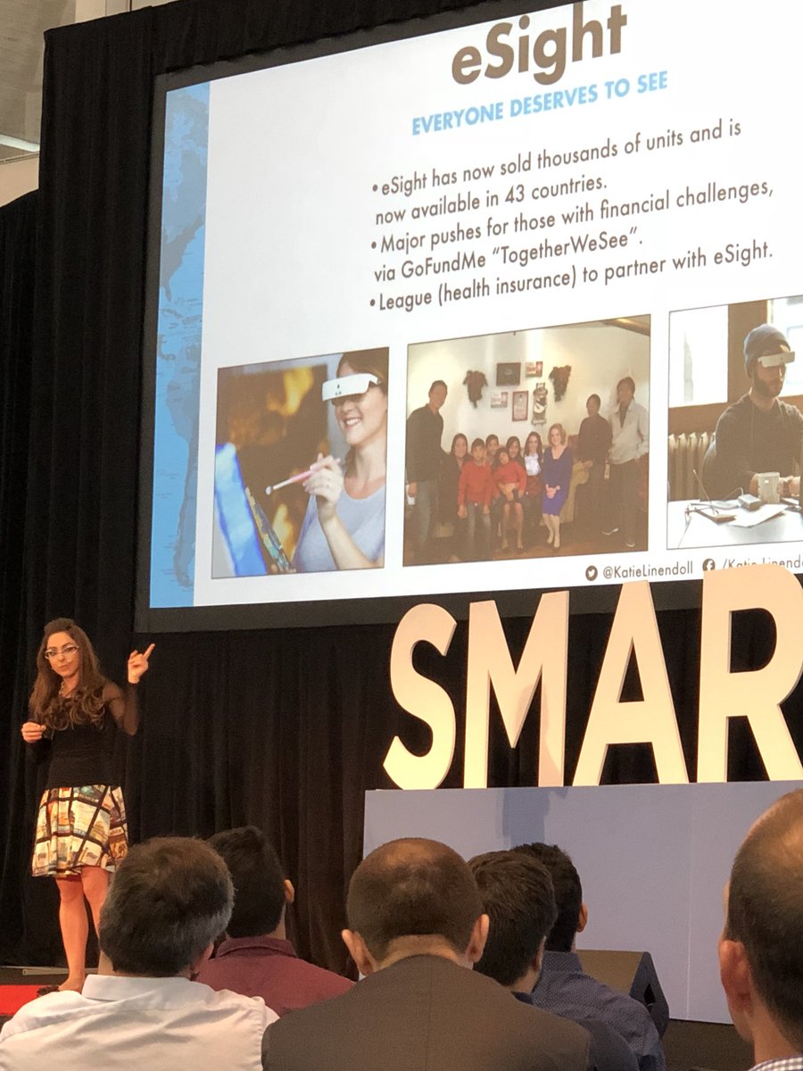 AndreasWeberUS's tweet photo. @KatieLinendoll giving #SMARTx speech about #eSight. Life changing technology! #SmartMfgExp18 https://t.co/DhBLSr771e