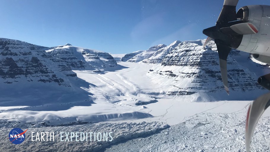 P-3 Orion aircraft flying over a glacier in Greenland