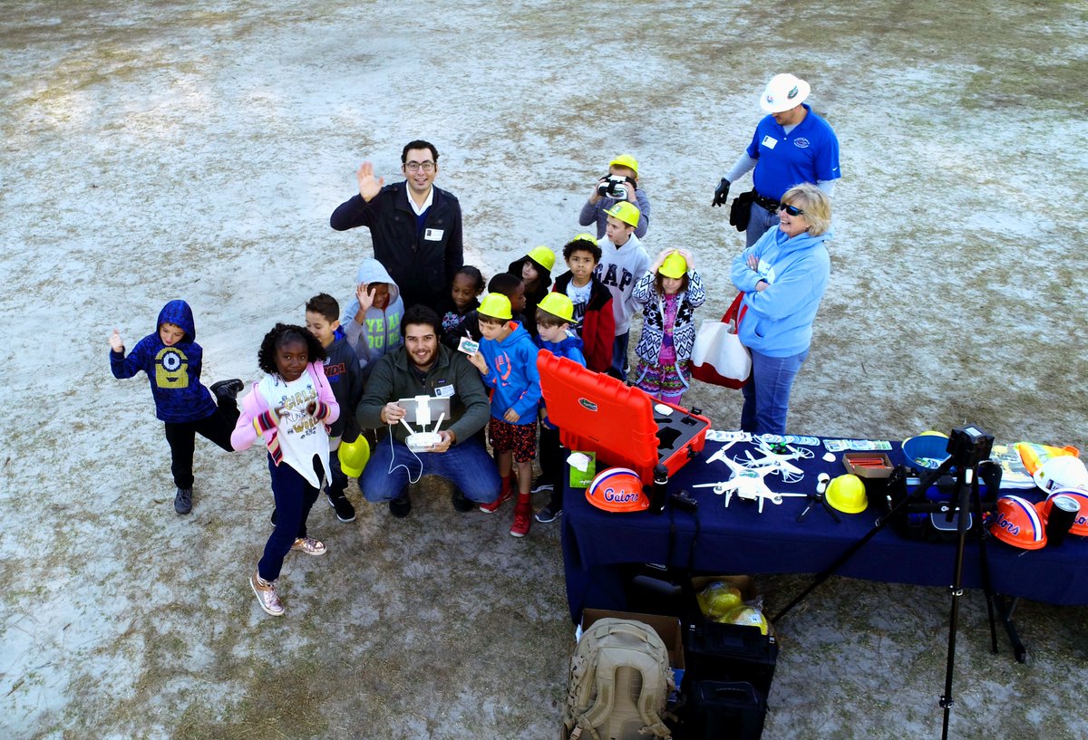 UFRinkerSchool's tweet photo. Dr. Gheisari, Dr. Costin, and PhD Student, Ricardo Eiris, attended the Archer Elementary Career Day. Students got to interact with the UAV and Virtual Reality Technology while wearing their own, mini Rinker School hardhats!
 #UFRinkerBuilds #BuildingGenerations https://t.co/CBl3A7K9gz