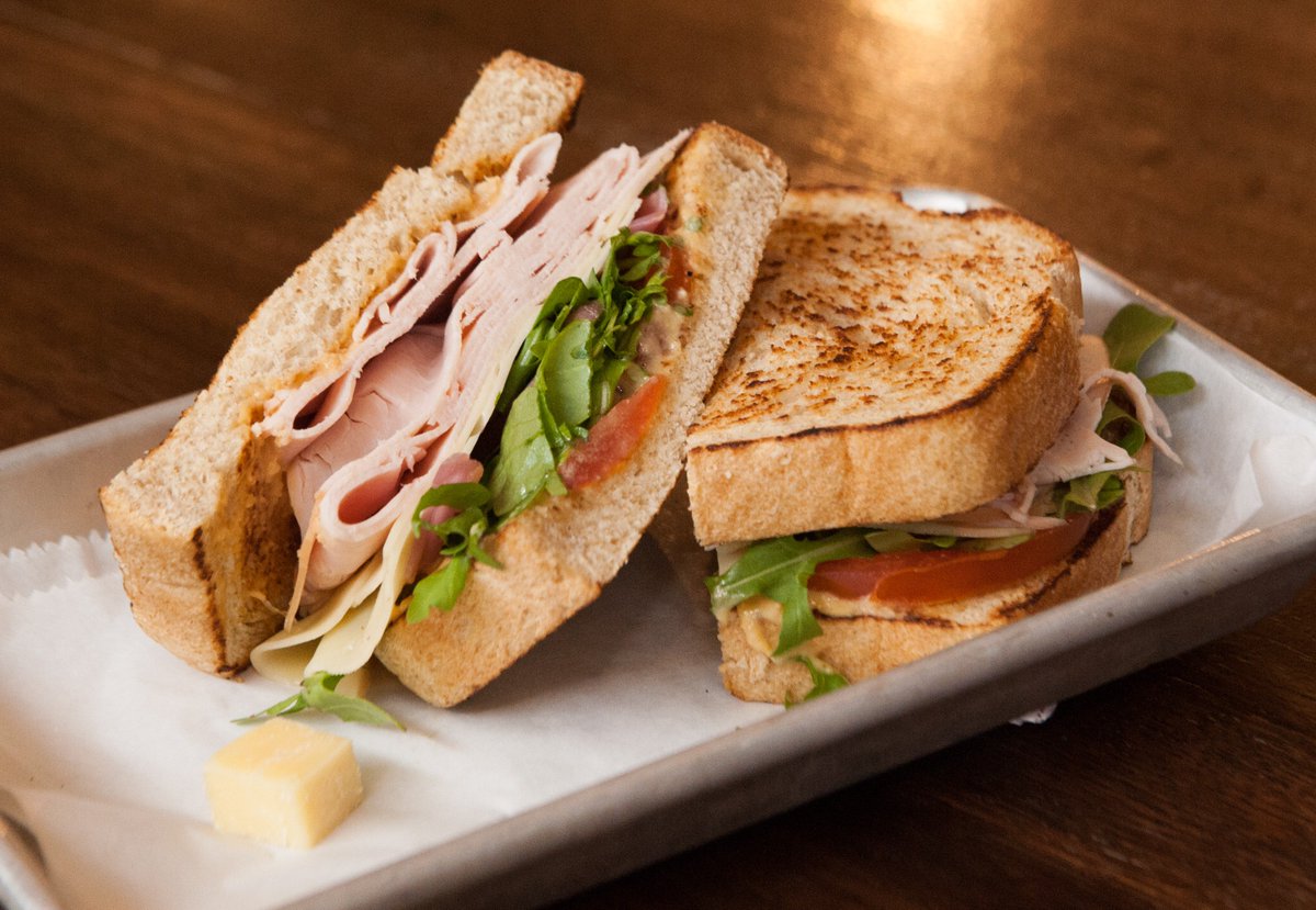 Take your #TastyTuesday up a notch with our new Turkey Sandwich featuring hummus, tomato, arugula, swiss, pickled onion, and sliced wheat. #mondomarket #sandwich #tuesday
