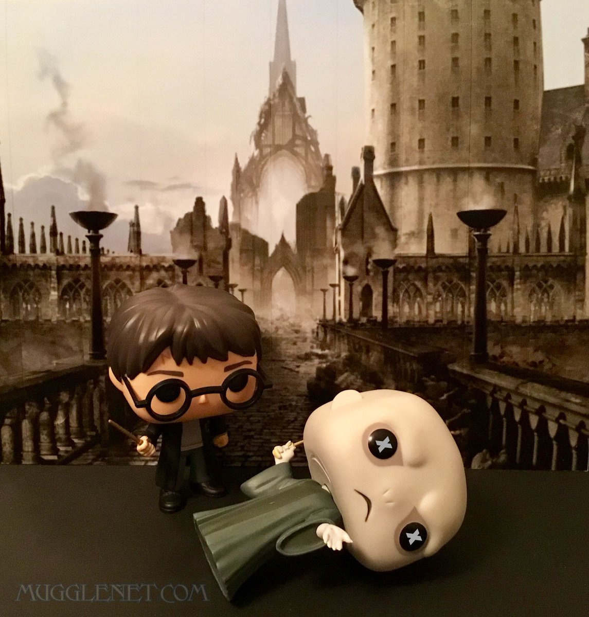 MuggleNet's tweet photo. The rising sun shines its first light into the room. Voldemort’s Killing Curse is countered by Harry’s Disarming Charm. “Voldemort was dead, killed by his own rebounding curse, and Harry stood with two wands in his hand, staring down at his enemy’s shell.” #BattleOfHogwarts20 https://t.co/vOEy3bqZxa