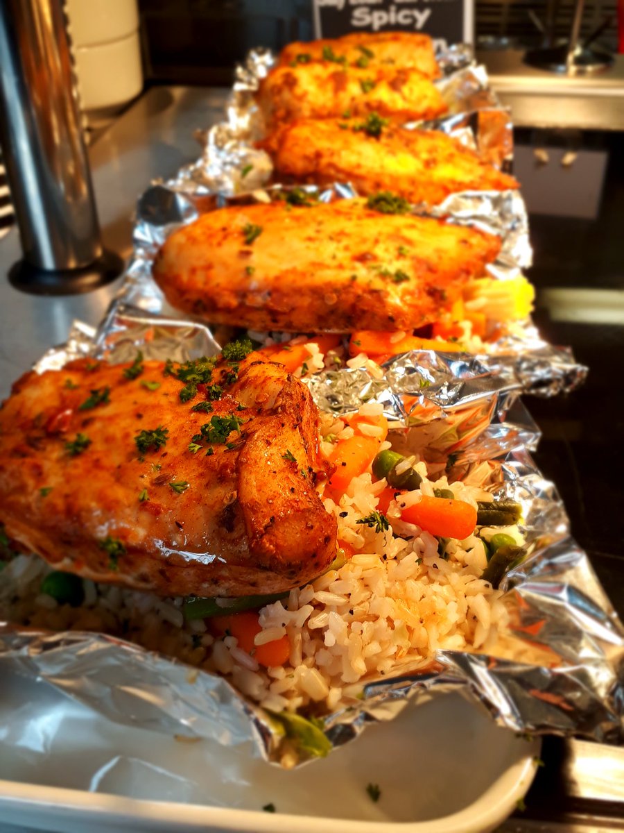 Today we're serving turkey escalops with roast potatoes, parmesan rice balls with chilli dip and spicy chicken fillets with rice. Come to Trafford Town Hall this lunchtime.
