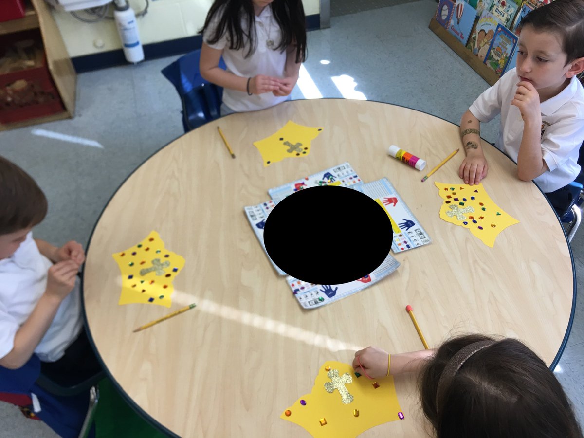 Kindergarten is honoring Mary, by making crowns for her.
