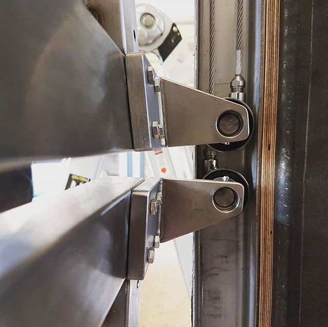 old_school_fab's tweet photo. All our stainless steel machined parts, bearings, pulleys and steel cable parts now installed and running very nicely. This is a detail from our counterbalanced exterior bifold shutters. A very exciting and innovative project with London based @mata_architects. #stainlessste… https://t.co/MqBCBAuoFE