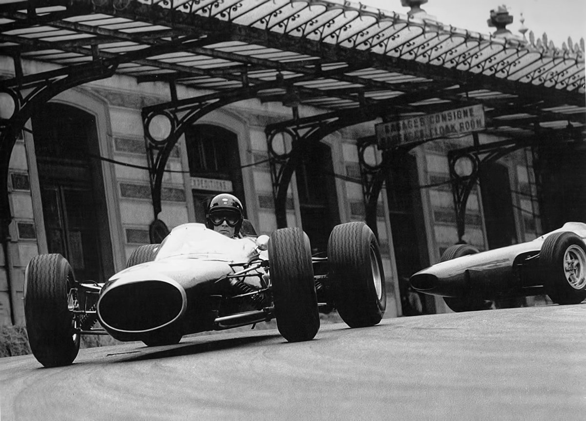 F1 1964 , Monaco .
Dan Gurney (Brabham BT11 Climax) chased by a Ferrari .
#F1 #Monaco #DanGurney #Brabham