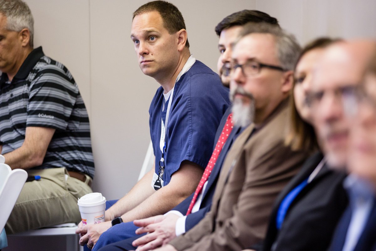 Image of a nurse intently listing.