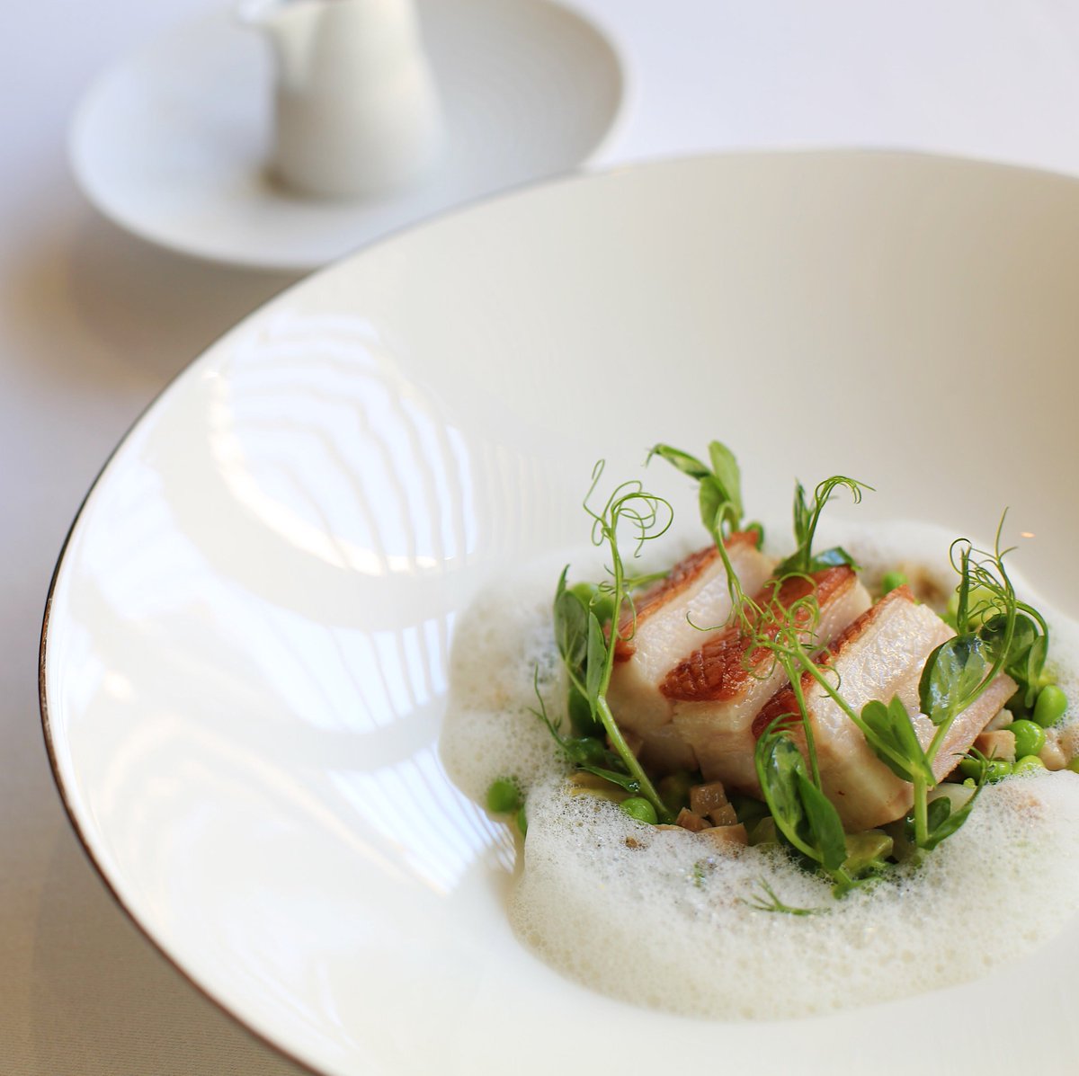 petrus's tweet photo. Blythburgh pork belly, lemon thyme and petit pois à la française. Experience the ultimate taste of Spring with lunch at Pétrus. Book now at https://t.co/2nN8I5s40c #PetrusRestaurant #MichelinStar https://t.co/fEk8xQwhN1