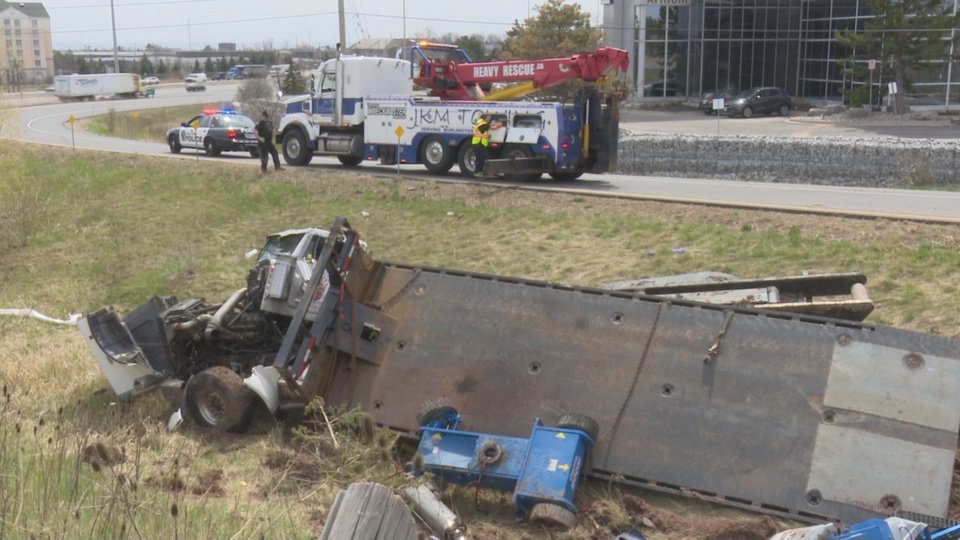Media371's tweet photo. .@JKMTowing starting recovery of a truck in the ditch at Burloak Drive and the QEW in #BurlOn. @HaltonPolice Collision Reconstruction Unit and @HRPSCMV continue to investigate. https://t.co/2iU88Nr58P
