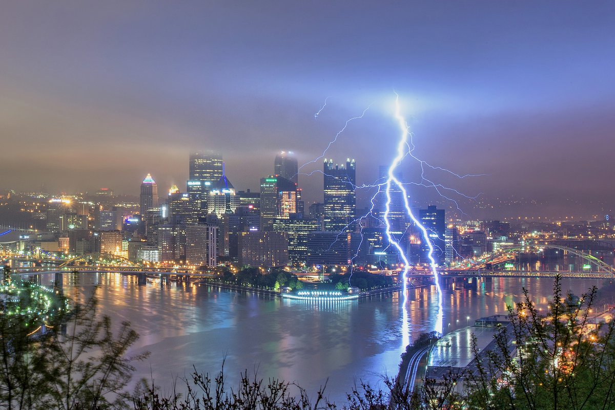 DaveDiCello's tweet photo. Two years ago today, I witnessed one of the most amazing things I've ever seen.  At 4:20 in the morning, I captured this image of a lightning bolt splitting as it hit the rivers of #Pittsburgh. I keep chasing storms in hopes of seeing a similar one, but I'm not sure I ever will. https://t.co/I0dBv81Qyf