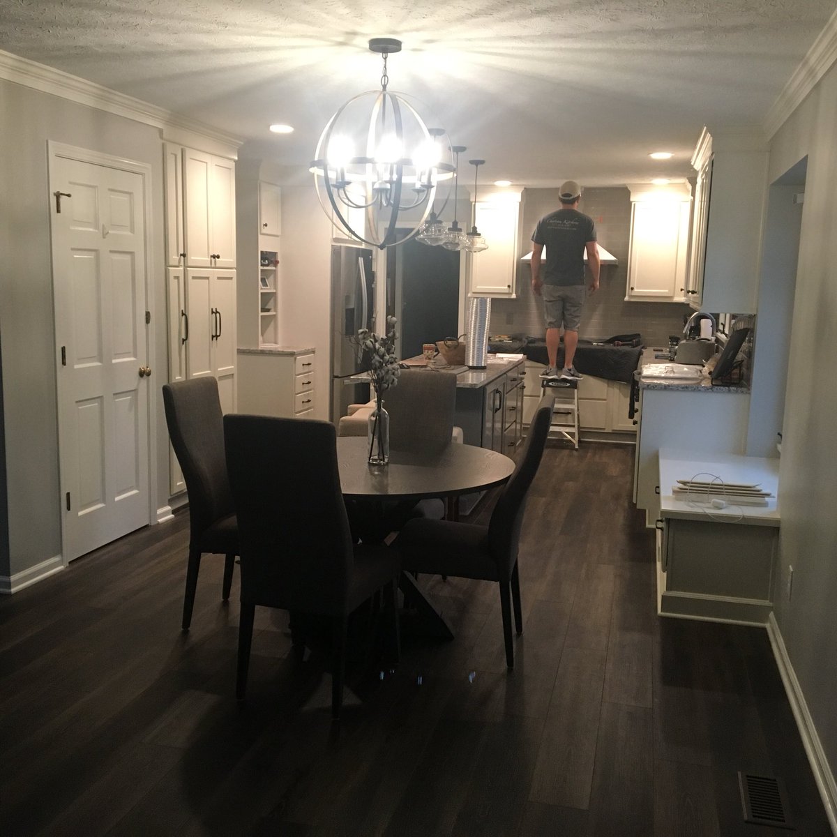 ChateauKitchens's tweet photo. Project Manager Ryan is hanging a stainless steel range hood, putting the final touch on this complete kitchen transformation! @KraftMaid #kitchendesign #remodeling #designershannon https://t.co/IIekGPp5zi