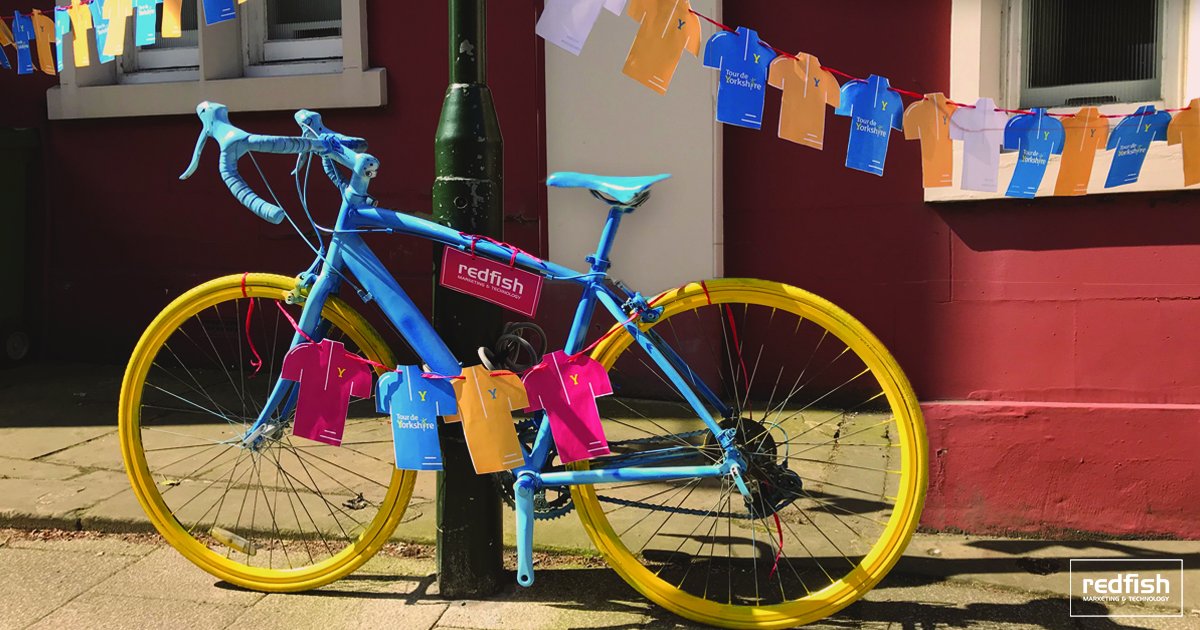 RedFishGroupUK's tweet photo. Happy Tour de Yorkshire all! Here at Redfish we are in the spirit of all things cycling. Our bunting is on display and our bike is complete thanks to https://t.co/oGl1UXYuTo. Thanks for generously giving us a bike for us to spray especially for the event https://t.co/LPohQelLUK