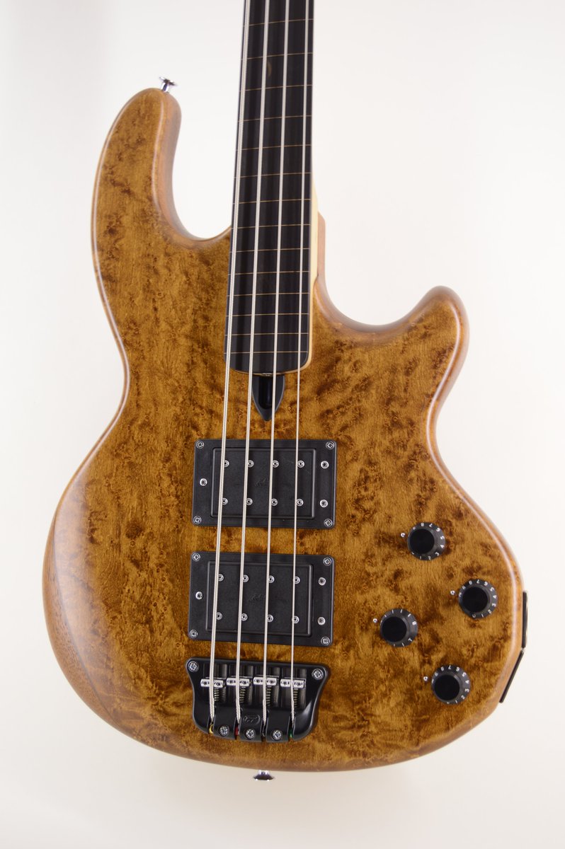 Birdseye maple facings with vintage Wal stain and satin finish on this fretless Mk2.