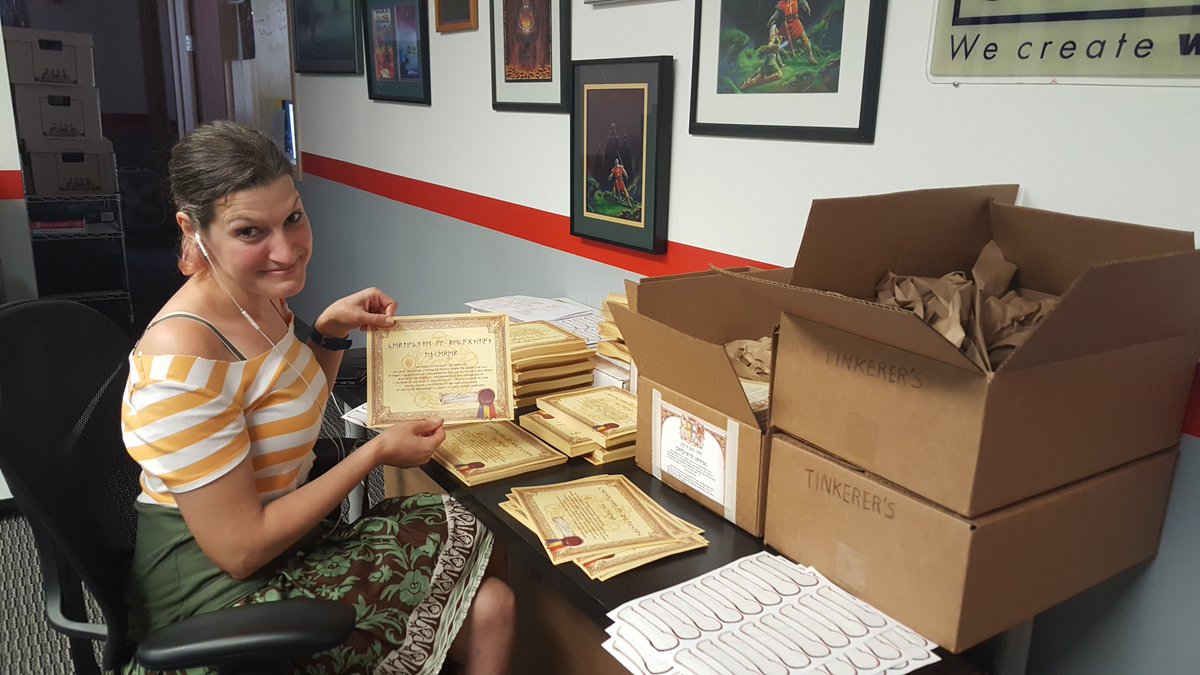 We're hard at work on preparing the physical goods for Kickstarter backers! Here is <a href="/BrekkenHoltrop/">Brekken Holtrop</a> placing <a href="/RichardGarriott/">Richard Garriott</a> signed stamps on each of the certificates. #LBSotA