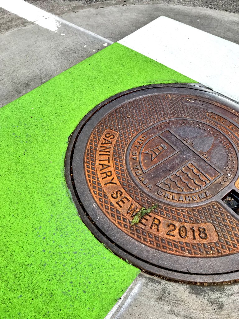 KRotering's tweet photo. When in @cityoftulsagov I get to check out newly completed @WalterPMooreEng projects; e.g., 31st Street #RoadDiet with buffered bike lanes and fresh green paint! Nice work @DanAshbaughWPM https://t.co/LdDcxf6rtM
