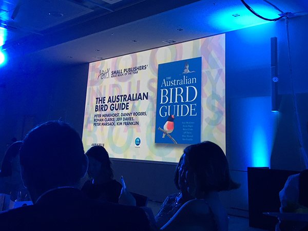 CSIROPublishing's tweet photo. Australian Bird Guide co-author Peter Menkhorst, his wife Barbara and publisher Briana Melideo had a wonderful time celebrating the #ausbirdguide's win at #ABIA2018 last night. Excellent tie, Peter. https://t.co/iaJihvYD6f