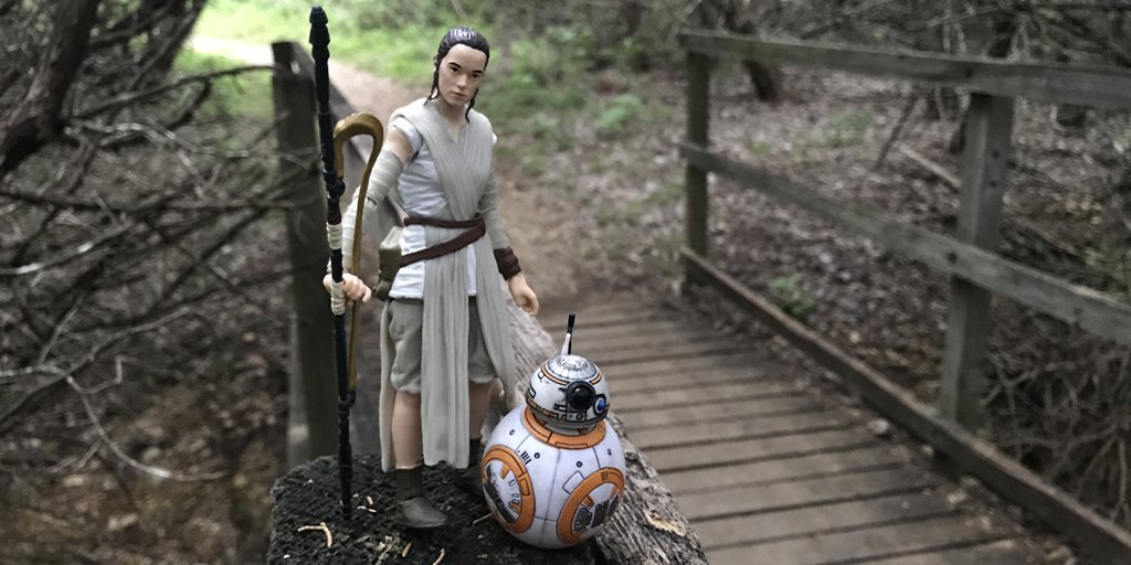 2 Star Wars character toys on a park trail