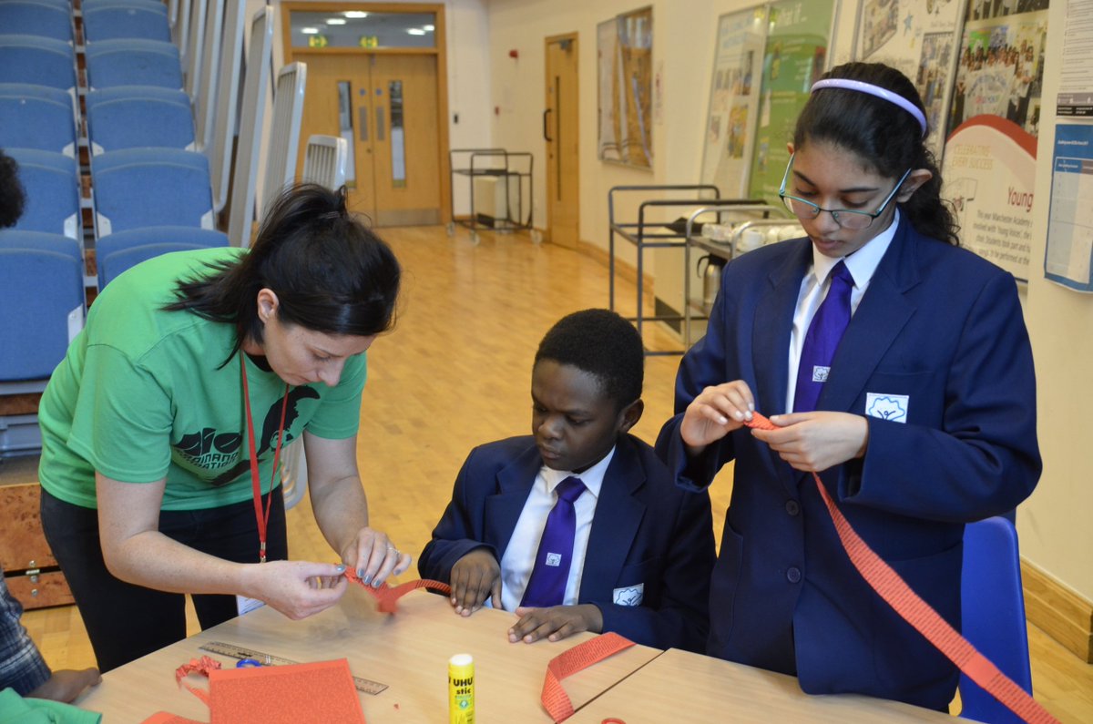McrAcademy's tweet photo. Our students have been busy making origami paper roses today to commemorate the victims of last May's MEN Arena terrorist attack. Former pupil Mohamed 'Max' came up with the idea & teamed up with @riofoundation to organise it, we made 150! #RFFManchester #EducationwithCharacter https://t.co/HKQ2DVUwWk