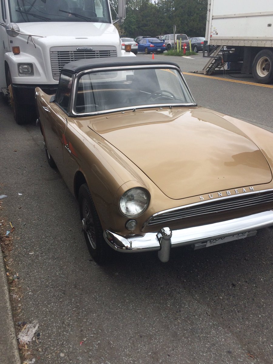 sam_andrsn's tweet photo. They're bringing in really neat vintage cars for today's Sabrina shoot. https://t.co/wM7ckZA2wv