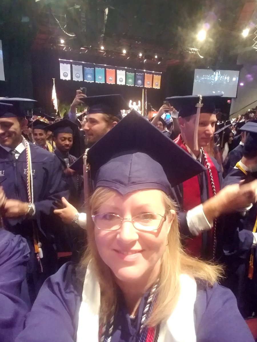 AnnGregoryDesig's tweet photo. FAU College of Business Graduation  with @FAUpresident showing off Owl fingers (right above my cap) #GoOwls #FAUSOA #Classof2018 https://t.co/pwWKSVRJi7