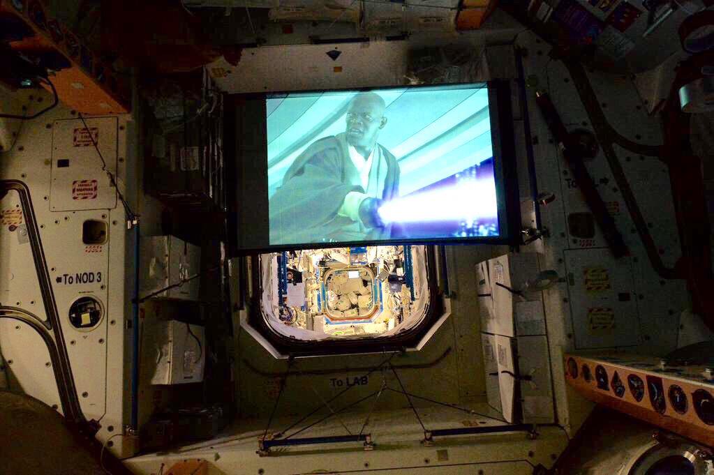 NASA's tweet image. We have a little bias, but we can’t think of a better place to watch @StarWars than the International @Space_Station. Here's a look at movie night in 2015 on the orbiting lab. #MayThe4thBeWithYou