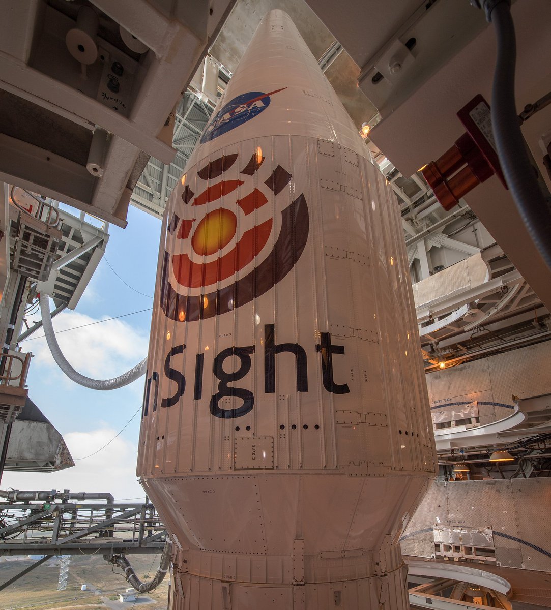 NASAInSight's tweet image. Are you ready to dive deep and study the heart of #Mars with me? I leave tomorrow to study the deep Martian interior. This big shiny rocket is my sweet ride! Learn more: go.nasa.gov/2JQY4VU