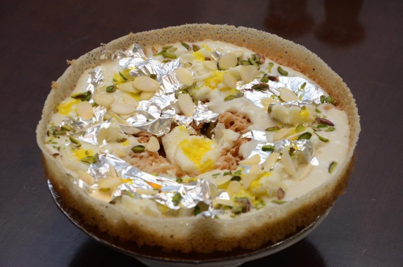 Ghevar is a North Indian cuisine sweet traditionally associated with the Teej Festival. It is disc-shaped sweet cake made with all-purpose flour and soaked in sugar syrup.  Check full recipe in 
aapnarecipe.in/recipe/ghevar