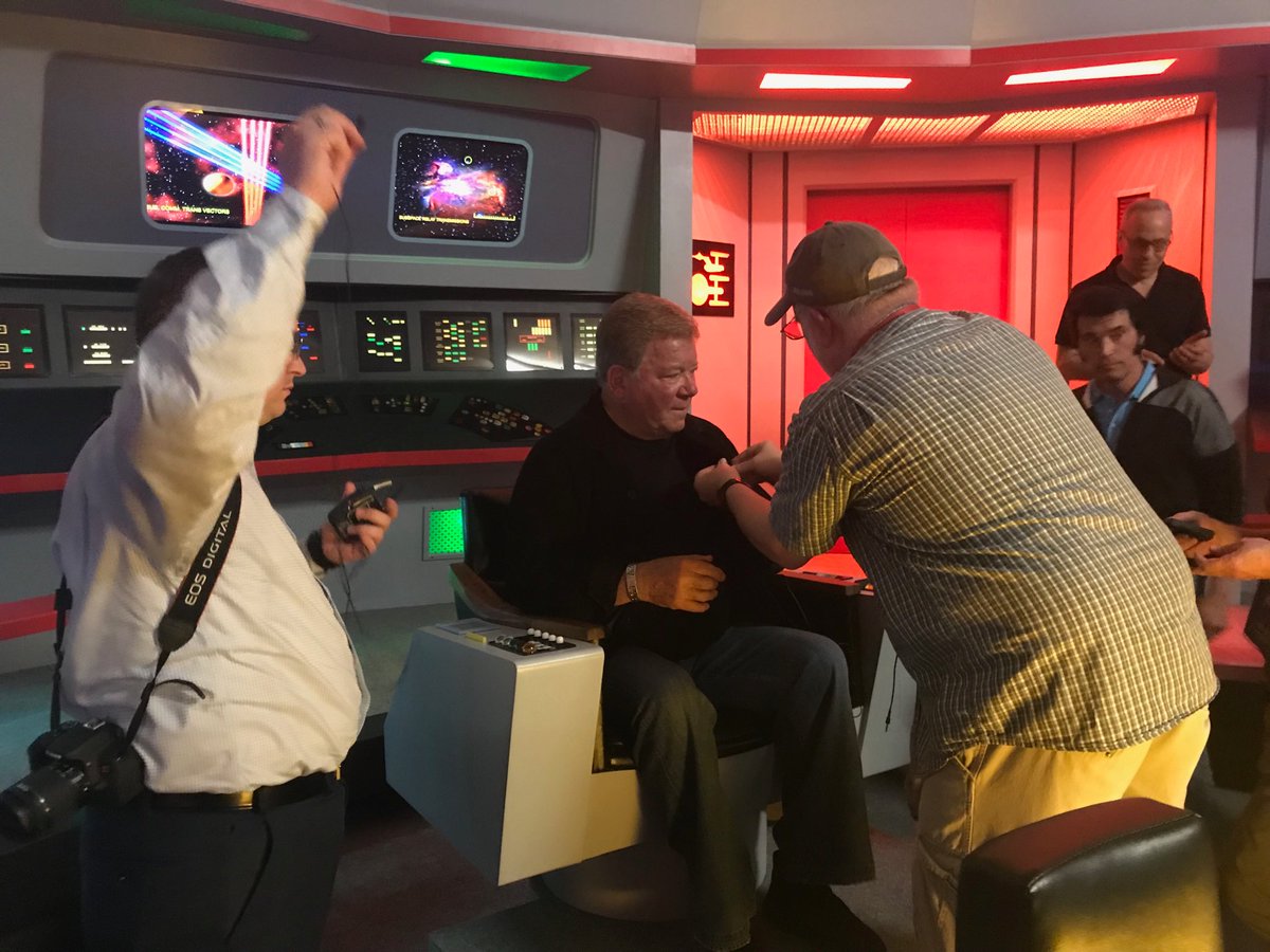 TrekMovie's tweet photo. Captain on the bridge! @WilliamShatner at the Star Trek Set Tour in Ticonderoga NY! https://t.co/19chJNEARJ