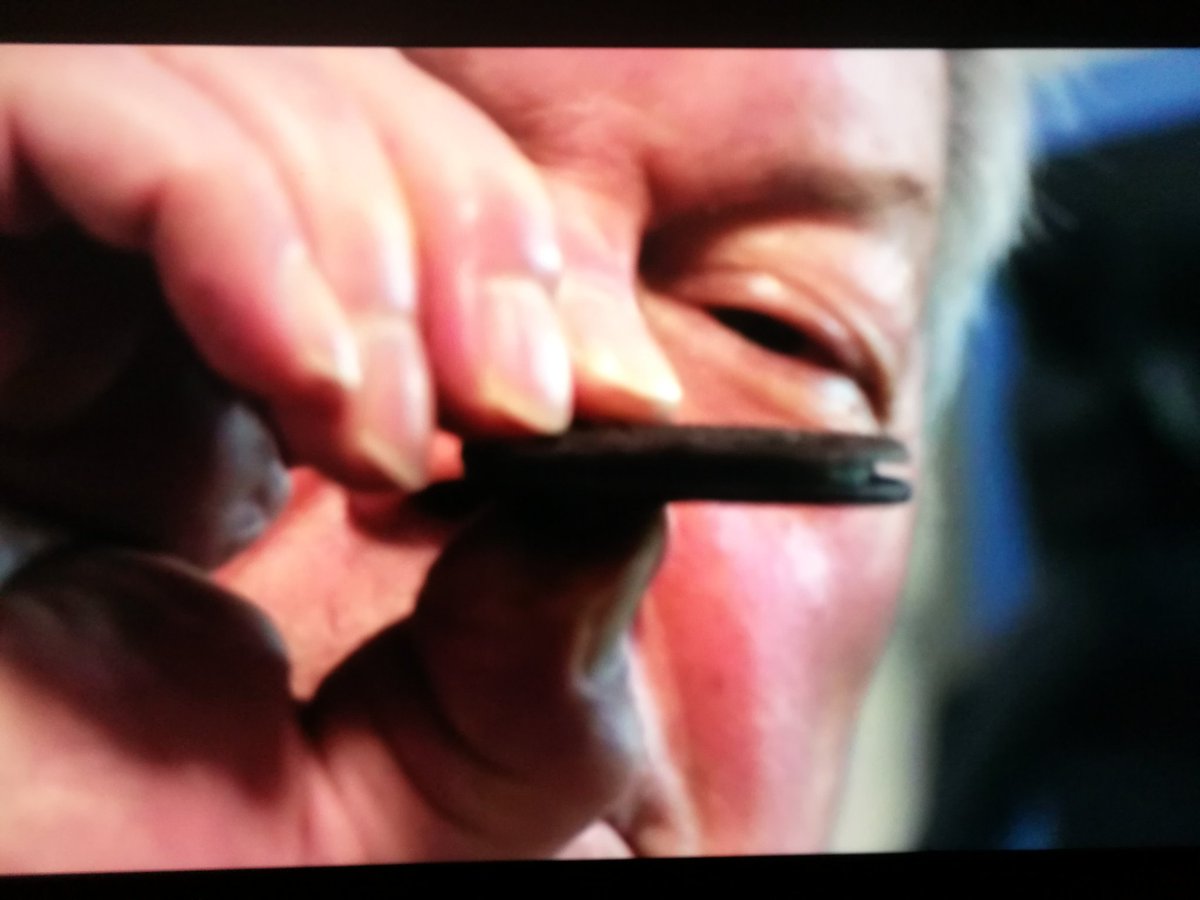 Today. A man measuring his biscuit filling with a ruler and recording it in a book.