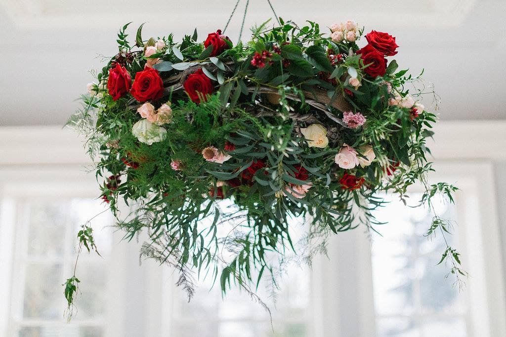 A stunning hanging design over a top table allows you to still sit at a round table with your guests but distinguishes your table as the Bridal party.