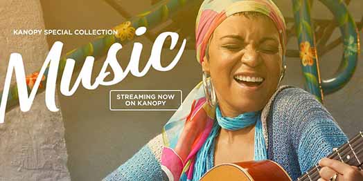 a woman singing with a gutiar