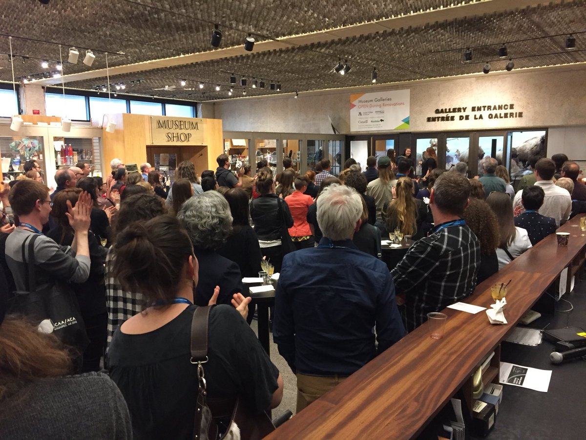 CAA2018Confere1's tweet photo. The crowd is gathered for the performers at the Indigenous reception @ManitobaMuseum for #CAA2018ACA https://t.co/27v8JQxC9x