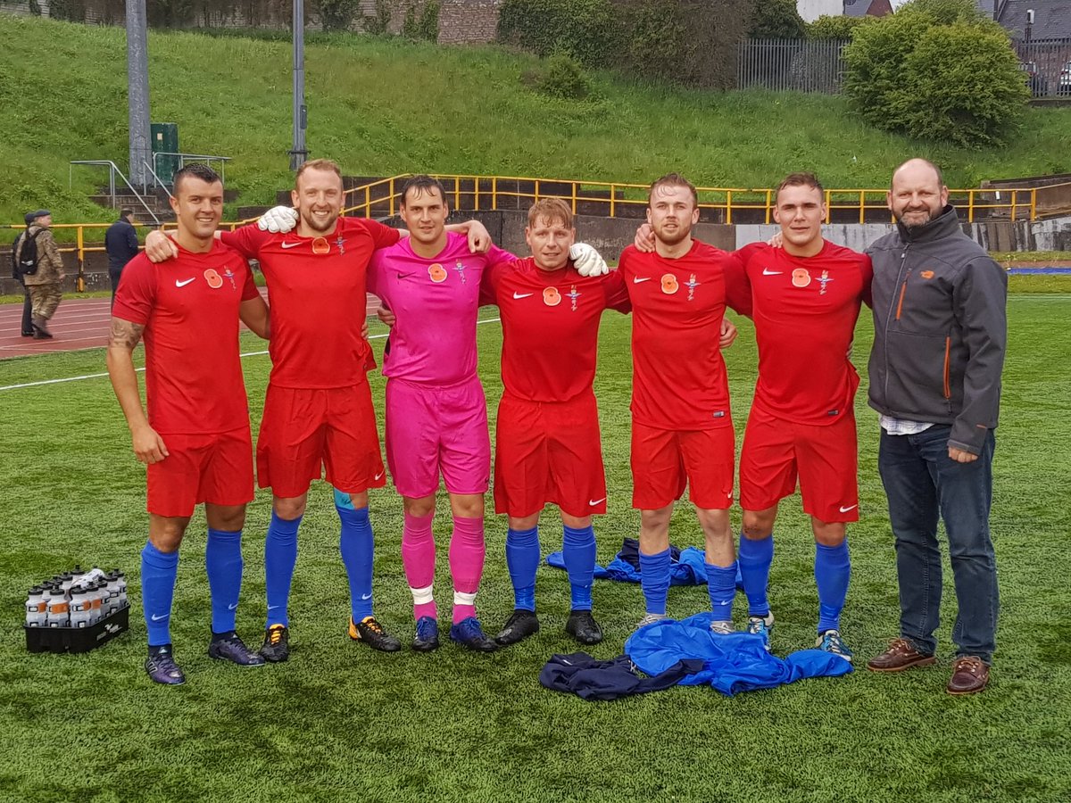 NavyFootball1's tweet photo. Navy manager WO Marty Wallace with RN players after their winning 3-0 performance representing UK Armed Forces against the Irish Defence force last at Barry Town FC. Congratulations to LCpl Mark Drysdale, AET Al Sneddon and Marine Steve Cross on making their debuts. #navfit https://t.co/YtE164mGUm