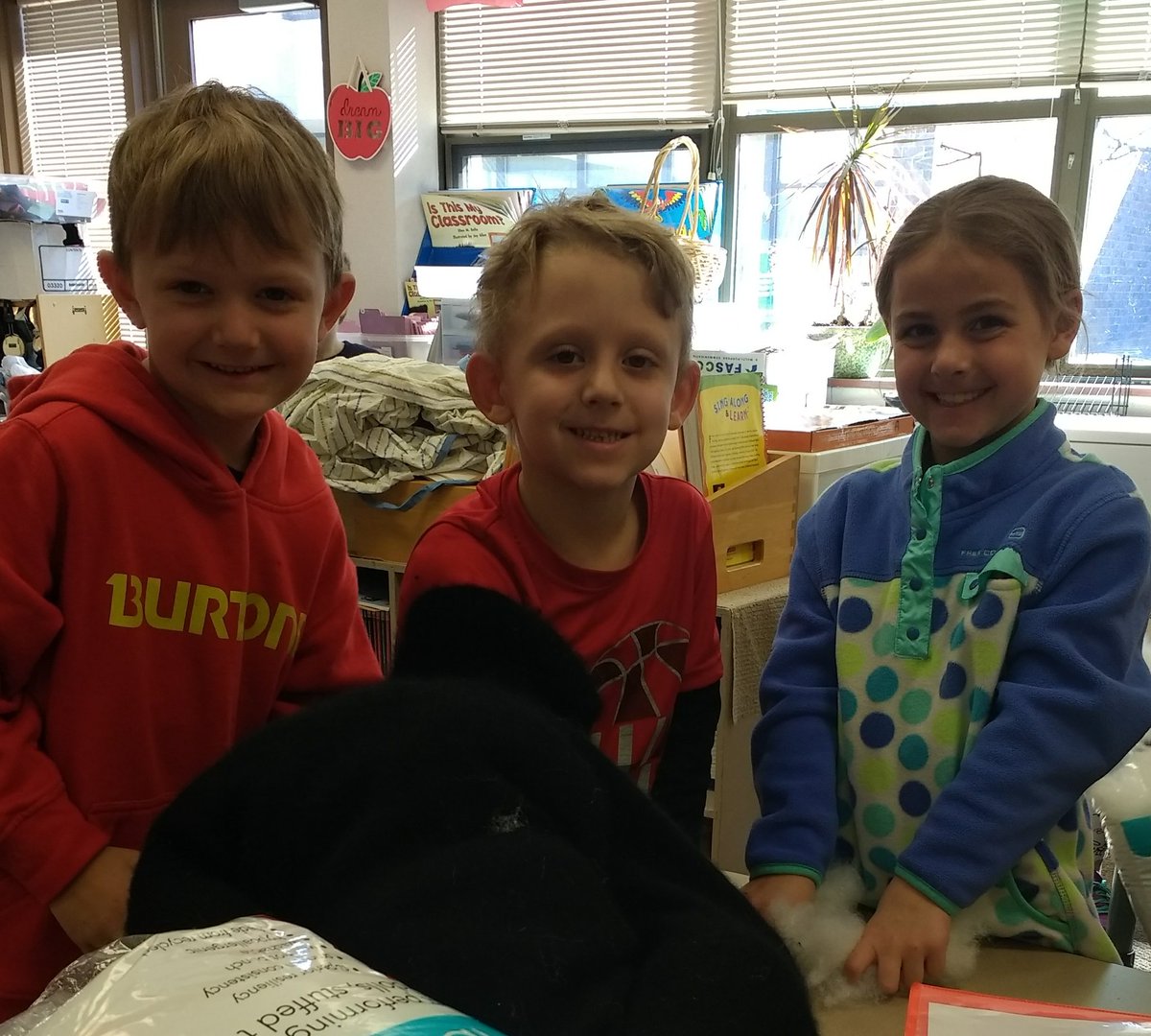 DFarantzos's tweet photo. KA learned how to reuse old sweaters and sew them into pet beds for the animal shelter! @rollingridgehc https://t.co/nklwBSkvPQ