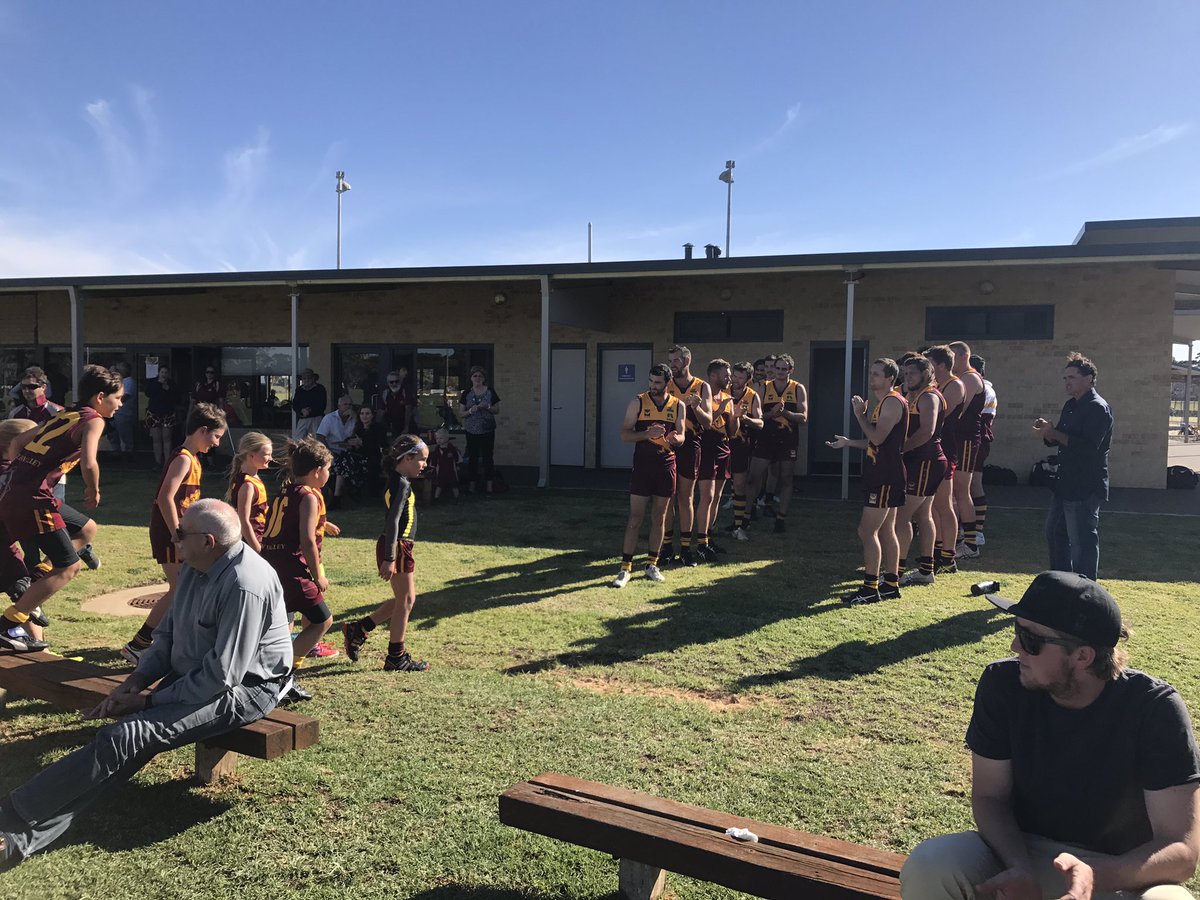 MrsJusak's tweet photo. Where it's at people. This is country doing it right. Our junior footy team had their first win in a number of years. This is our A grade side welcoming them back to the change rooms before they run out for their match. #gothegrowl https://t.co/e8T1vqQxnz
