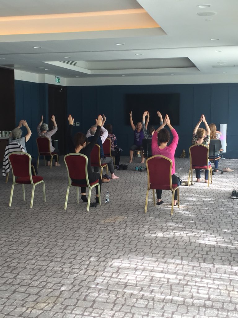 SpinalIreland's tweet photo. We are delighted to have Anna Teague teaching chair yoga today at #GotYourBackIreland2018 Anna’s classses are open to anyone with restricted movement including wheelchair users. Anna believes that yoga can be adapted to suit all bodies! #spinalinjuriesireland https://t.co/5cxcOQEOU5