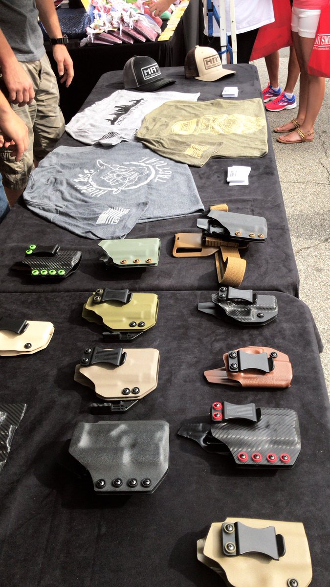 HighRiseTac's tweet photo. Holsters and apparel on display at the Carrollton Mayfest! Our tent is located near city hall! #HighRiseTactical https://t.co/JT2iqdgsMk