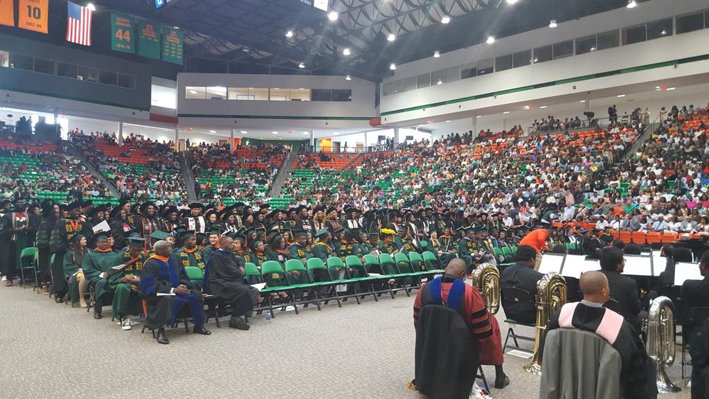 FAMU_1887's tweet photo. Graduates from the @FAMUCOPPS and @FAMULaw hood each other at #FAMUgradSpring18. https://t.co/IDaHEizzAq
