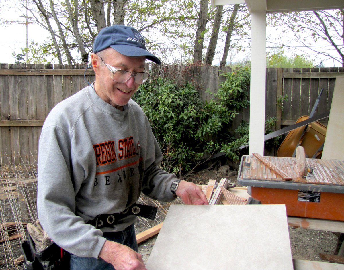 BentonHabitat's tweet photo. Volunteer John Ladd preparing to cut bathroom tile at the Garcia-Navarro home on Partridge. We are nearing the finish line on the house! Thanks for all the work the volunteers do to make Affordable Housing a REALITY in Benton County!! #affordablehousing https://t.co/f54UH18vti