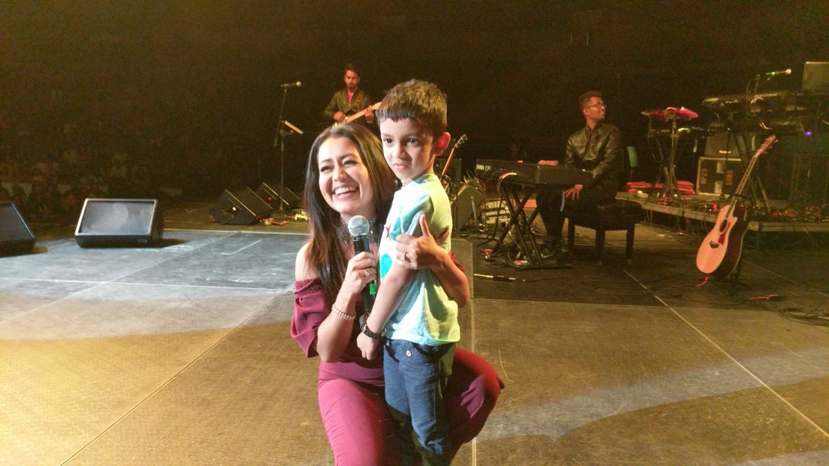 nihusheth's tweet photo. @iAmNehaKakkar thank you for fulfilling my 4 year old nephew’s dream to meet his favorite Neha Kakkar. This is a priceless moment for him. Thank you for watching his video and calling him on stage to meet you. https://t.co/35HBh9c4Hs