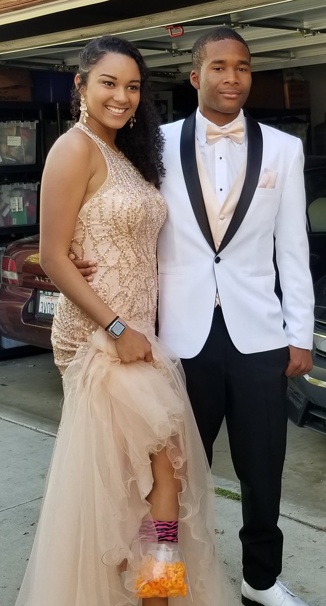 DariusCottrell's tweet photo. #Prom isn't Prom unless you have #cheetos!! #Nowthisishowyoudoprom #Classof2019. The right #accessories for #promaccessories is what you need! But what a lovely couple! #PromCouple #Prom2k18 https://t.co/FKWKLt4sU8