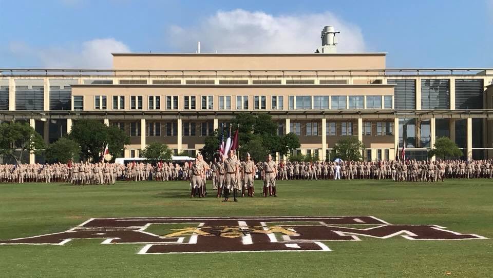 The corps lined up on Simpson drill field in their companies on a sunny day